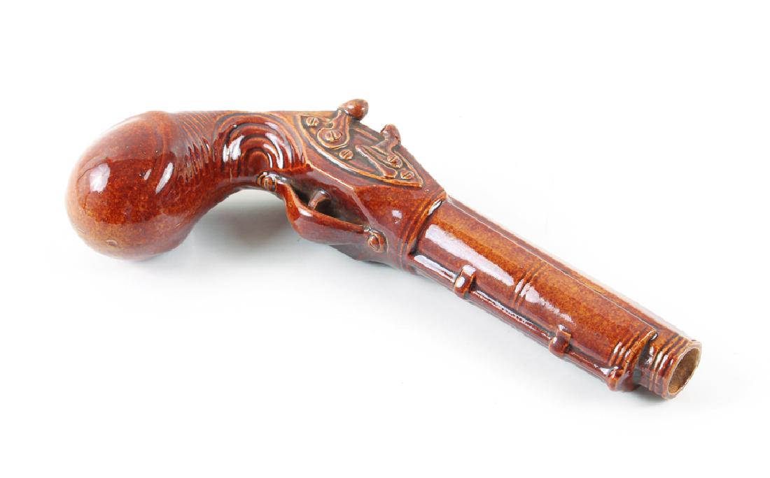 Doulton Lambeth Early Stoneware Pistol Flask: Doulton Lambeth Pistol Flask, Early Stoneware Pistol Flask manufactured for Dewar?s Perth Whisky, Gun Flask, circa 1840, Stoneware, 2 x 9 1/5 x 4.5 inches, Provenance: The Boca Raton Museum of Art