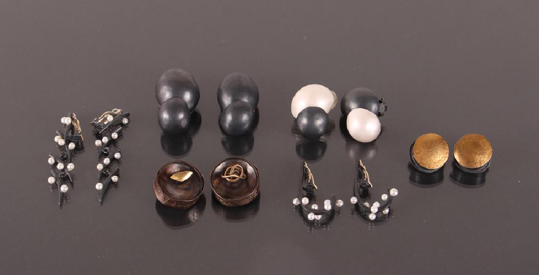 Six Pair Gun Metal Earrings: Six pair of earrings, all clip, with gun metal steel or similar metals, with various accents including gold colored metal and small pearls, longest 2.25 inches.