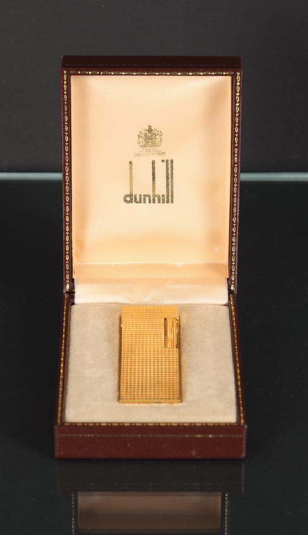 Dunhill Lighter in Original Box: Dunhill lighter in original box with paperwork. Estate of Garth Massingill.