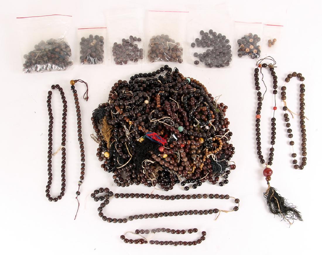 Large Group of Wood and Plastic Prayer Beads: Large group of wood and plastic prayer beads, some carved, and most approximately 7/16 inches. Provenance: The Collection of Ruth Frank