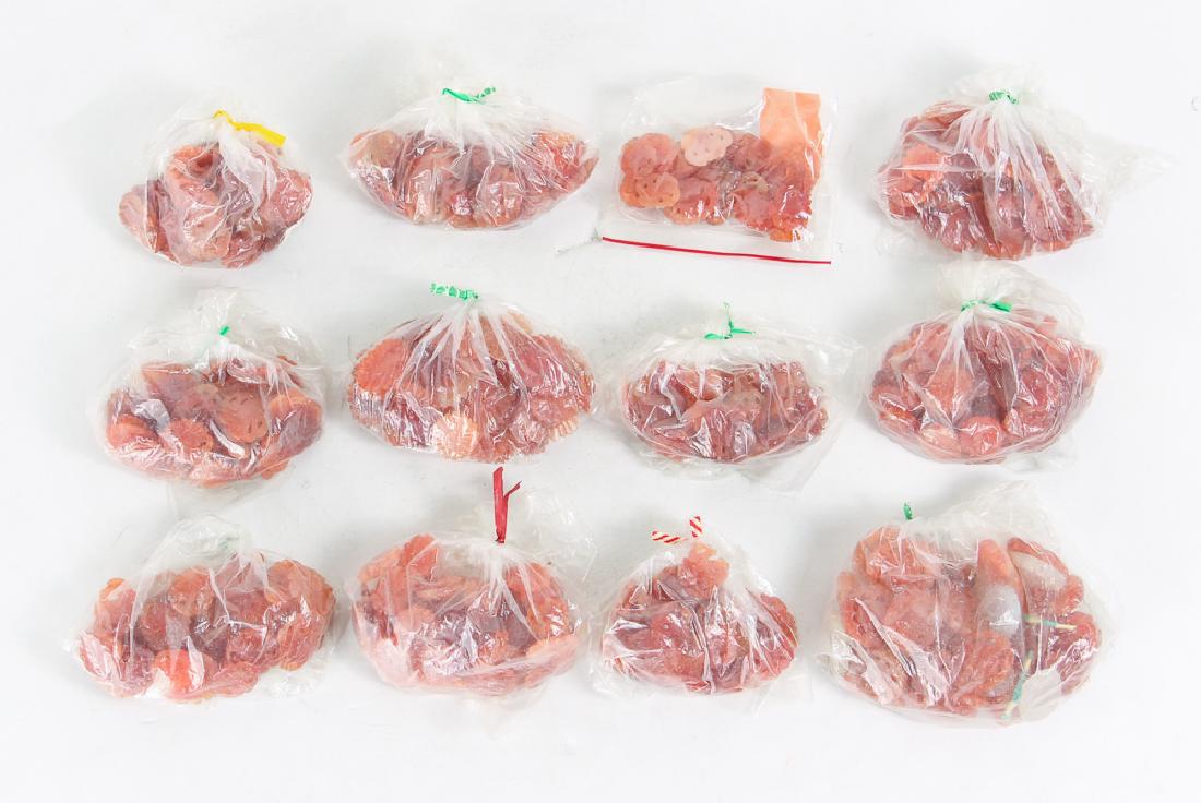 Large Group of Carved Carnelian Ornaments: Large group of carved carnelian ornaments, approximately 1000 pieces, all approximately 3/4 of an inch, with various Chinese floral and geometric carvings. Provenance: The Collection of Ruth Frank