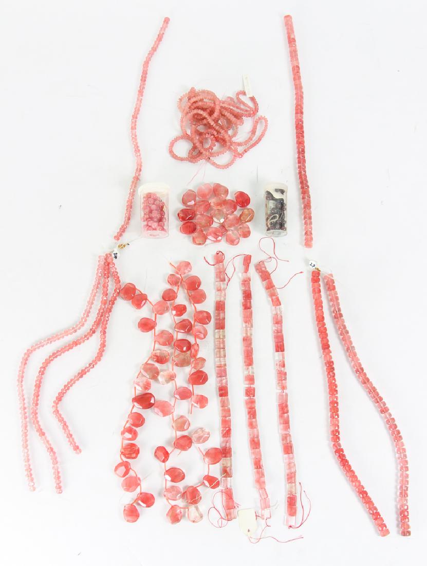 Group of Pink and Colored Beads: Group of pink and red colored beads, comprising beads of glass, rubies, rhodochrosite, and more, ranging in size from 1/8 to 1 1/2 inches. Provenance: Collection of Ruth Frank.