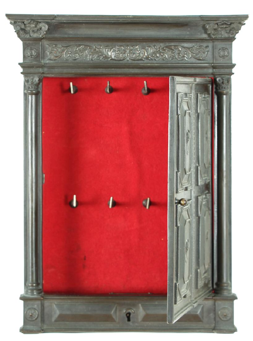 Grand Tour Bronze Key Safe: Key safe, bronze, in the form of a doorway, measuring 14 by 10 by 2 inches. Provenance: Estate of Bettelou Sorci, Guiding Light, Pittsburgh, PA.