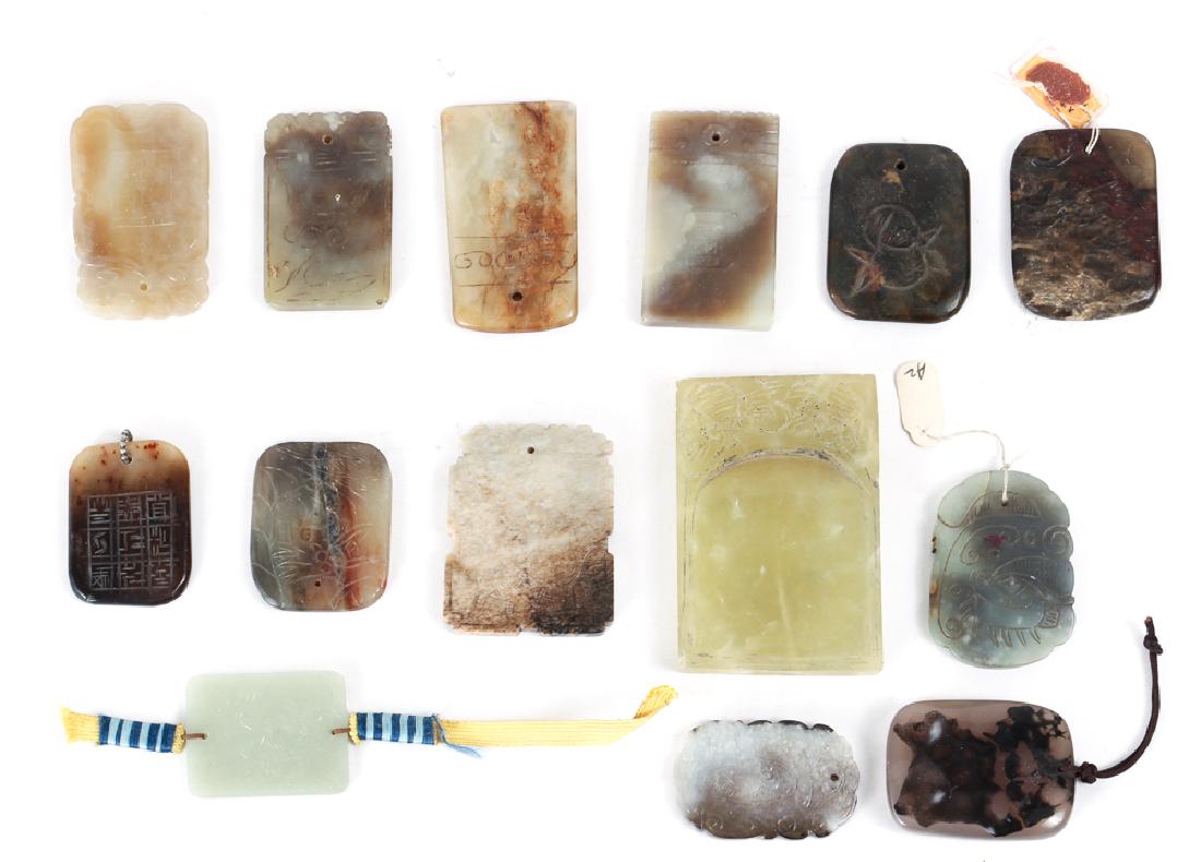 Fourteen Jade or Nephrite Pendants Amulets: Fourteen jade or nephrite pendants or amulets, Chinese, ranging in size from 2 to 3.25 inches. Collection of Ruth Frank, Pittsburgh, PA.