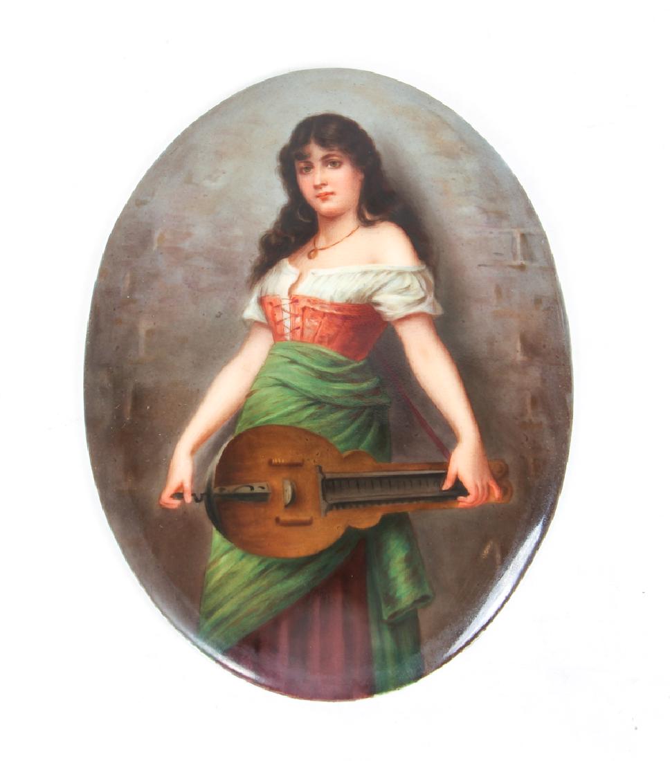Girl with Hurdy Gurdy German Painting on Porcelain: Girl with hurdy gurdy, painting on porcelain, German, signed lower right, measuring 7 by 5.25 inches, in a gilt frame in a shadow box frame measuring 14 by 11 inches.