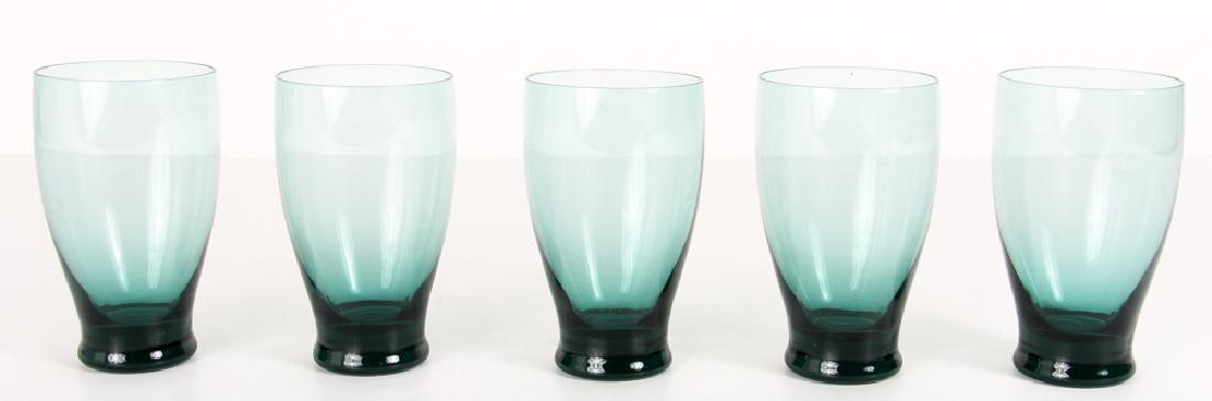 5 Russel Wright American Modern Tall Tumblers: Five Russel Wright American Modern Tall Tumblers by Old Morgantown. Set of 5 green glass tumblers. Measures 5" h, 3"w.