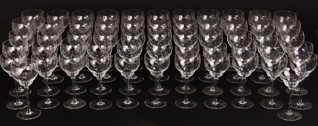 Cartier Crystal Stemware: Cartier crystal stemware. Assorted sizes including 22 water goblets, 18 red wines and 17 white wine glasses. Incised "Cartier" on the base of each piece. The water goblets measure 8 1/4" tall, red win