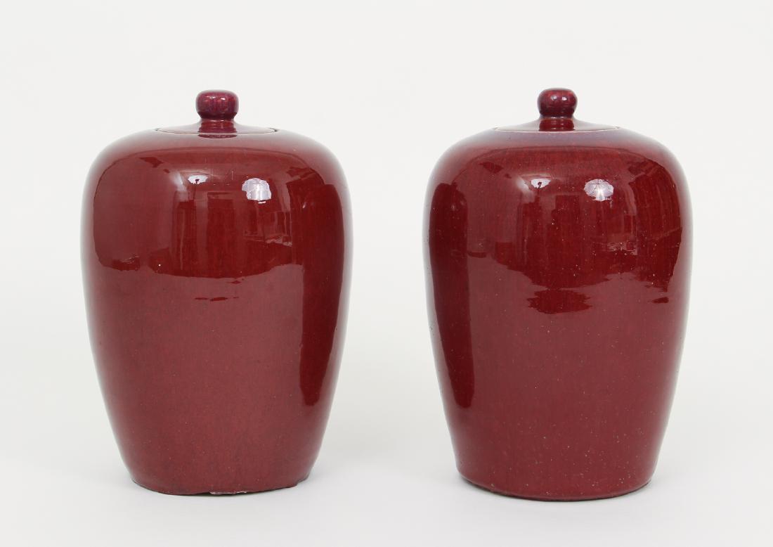 Pair of Antique Chinese Sang De Boeuf Jars: Pair of antique Chinese Sang de Boeuf lidded jars, 12 inches each.