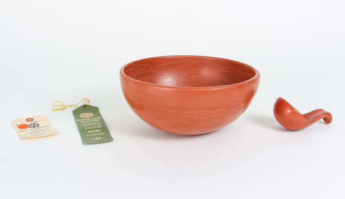 Zella Cheeda Redware Bowl and Ladle: Zella Cheeda redware bowl and ladle, Hopi, with Honorable Mention ribbon for Museum of Northern Arizona Hopi Exhibit, 4 by 9.5 inches. Provenance: Collection of Dr. and Mrs. Howard Tanning, Pittsburgh