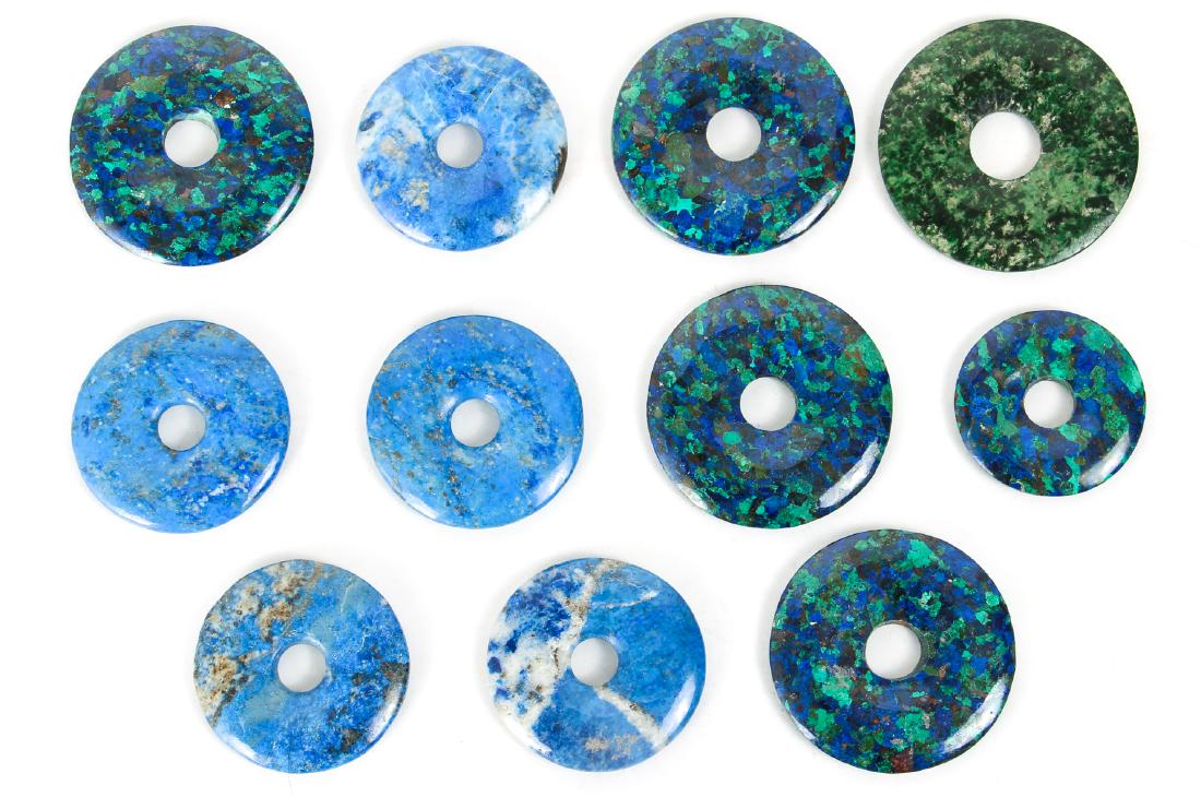 Eleven Lapis and Related Chinese Bi Discs: Eleven lapis and related bi discs, Chinese, measuring 30 to 40 mm. Collection of Ruth Frank, Pittsburgh, PA.