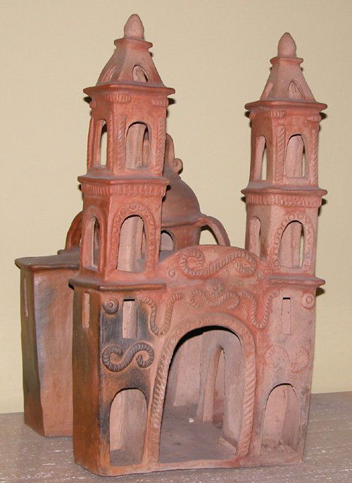 Old Basilica of Guadalupe Mexican Ceramic: Artist: Early to mid-20th Century Mexican Ceramic School Title: Freestanding Miniature Cathedral with Stylized Snake Designs on the façade based upon Old Basilica of Guadalupe Medium: unglazed cerami