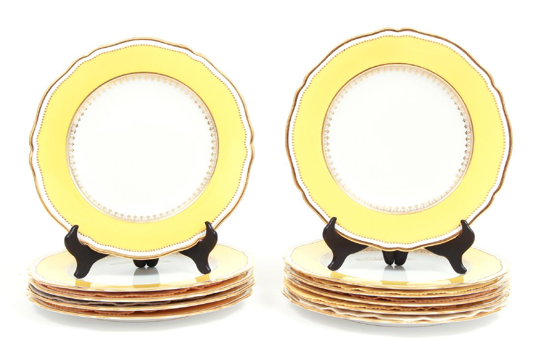 Eleven Spode Copelands Dinner Plates: Eleven Spode Copeland's dinner plates, with yellow and gilt borders, 10 1/2 inches.