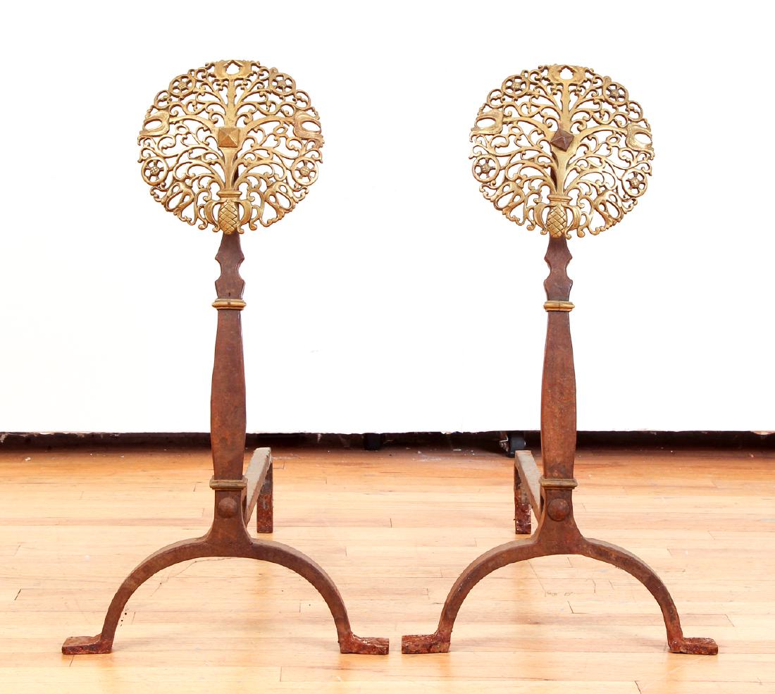 Ornate Bronze and Wrought Iron Andirons: Pair of ornate bronze and wrought iron andirons, probably English, late 19th century, featuring cast pierced bronze rosettes, 27 inches tall.