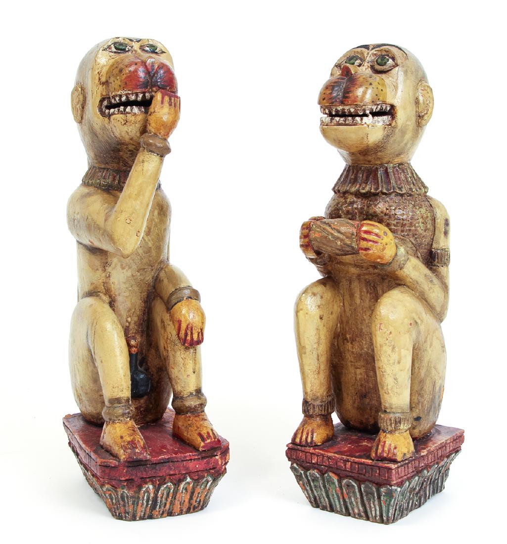 Two Painted Carved Wood Monkeys: Two painted carved wood monkeys, possibly Polynesian, 16 inches.