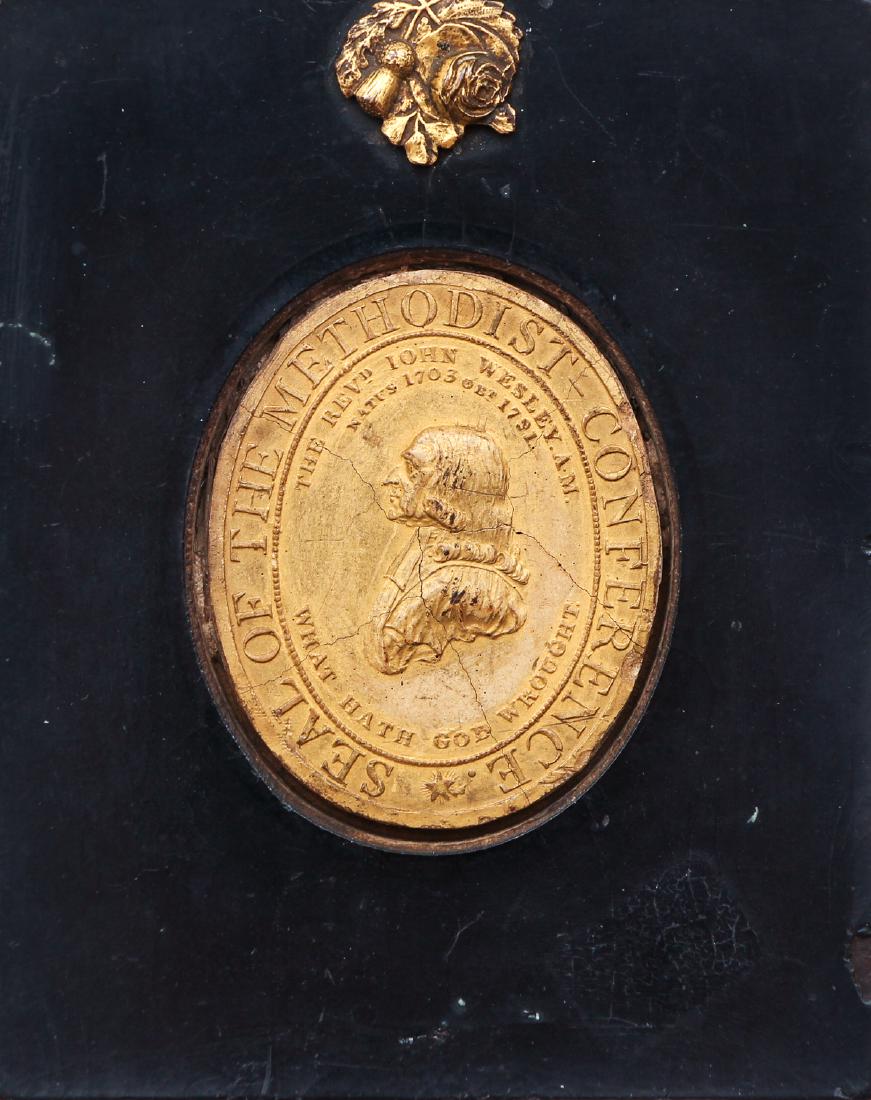 Framed Seal of the Methodist Conference: Framed seal of The Methodist Conference. The Reverend John Wesley A.M. 1703-1791. The back of the frame has an attached copy of a letter "To the Methodist Connection at Large" printed January 1890. Me