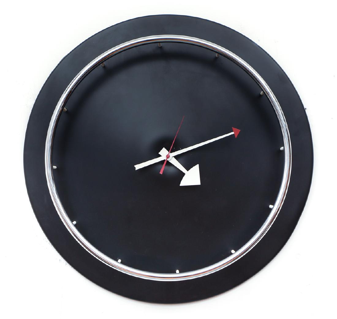 George Nelson clock by Howard Miller: Nelson, George for Howard Miller clock, white metal hands with black face and steel ring around peripheral, 19 inches in diameter.