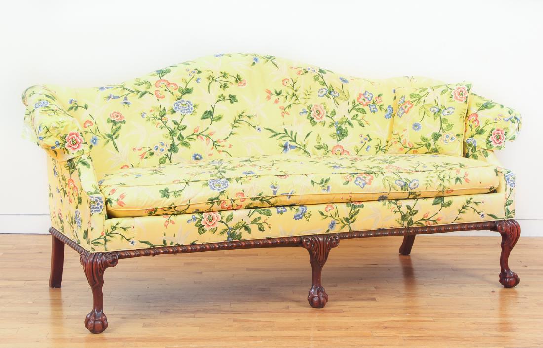 Hickory Furniture Chippendale Sofa: Hickory Furniture Chippendale sofa with ball and claw feet, in yellow floral upholstery, 35 by 30 by 70 inches.