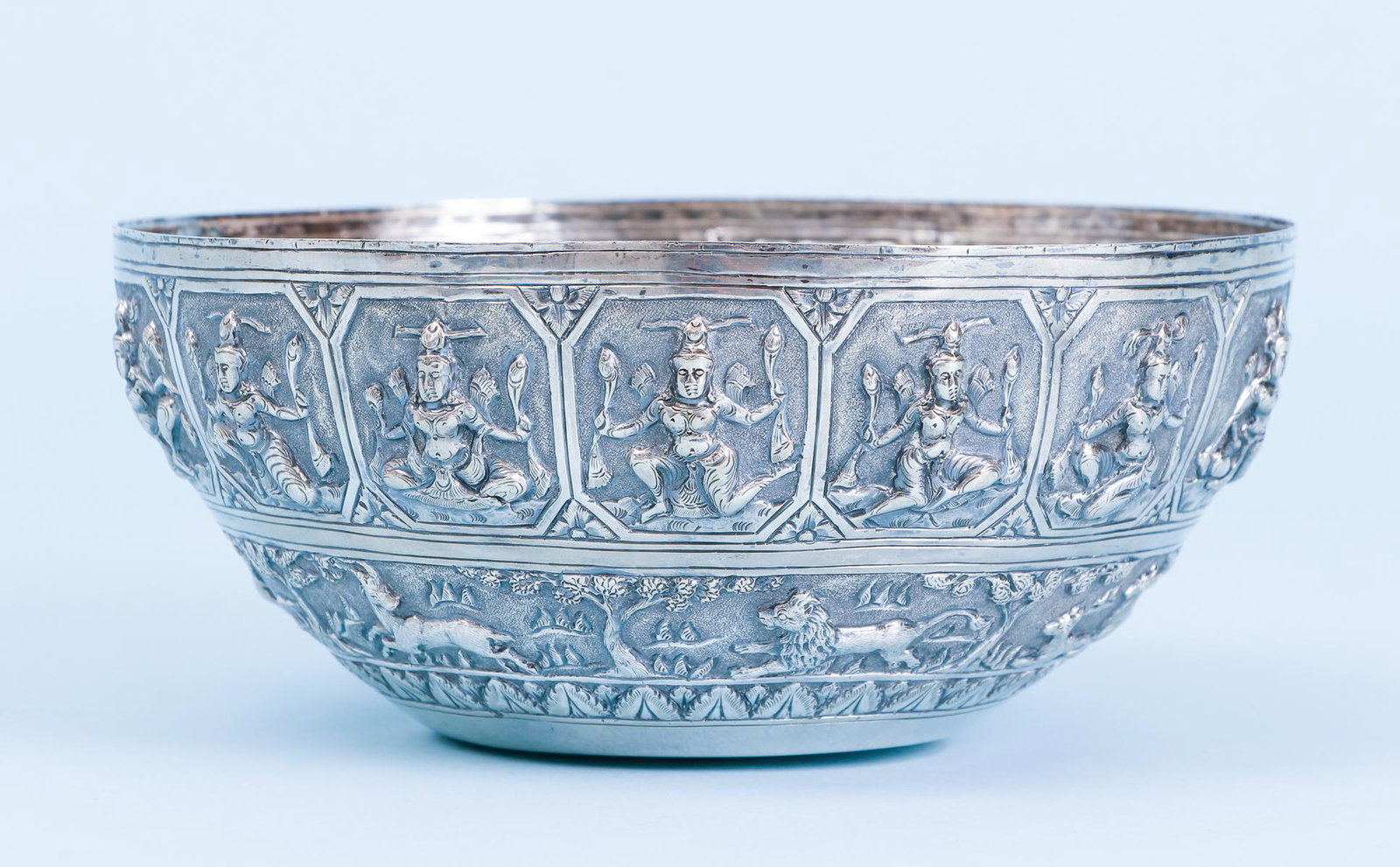 Indian 19th Century Sterling Silver Bowl: Extensive repousse decoration featuring a band of 15 non repeating Yoga positions above a band of Konaalini, naturalistically rendered animals including lions, tigers, antelopes, hounds, and rabbits, 