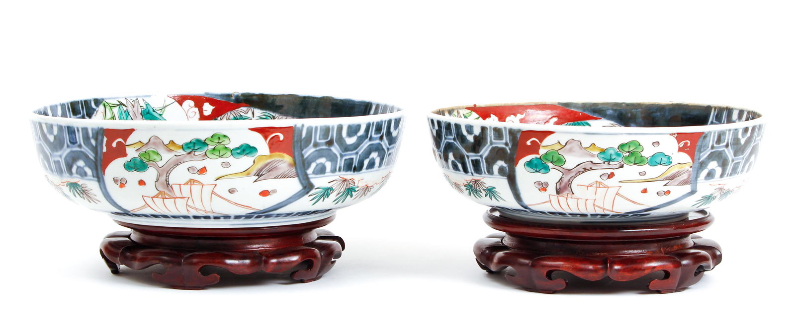 Near Pair of Japanese Imari Bowls on Stands: Pair of antique Japanese Imari bowls on stands, 3 3/4 by 12 1/4 inches, other slightly smaller, excluding the stands.