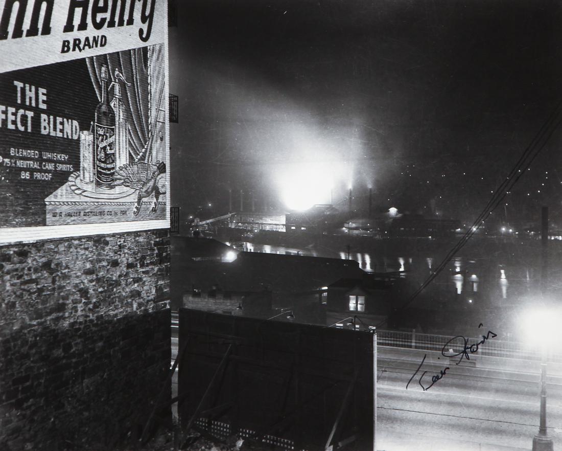 Teenie Harris signed photo Steel Mills with Whiskey Ad,: Harris, (Charles) Teenie (American 1908-1998), View of smoky J & L steel mills with advertisement for John Henry whiskey painted on building in foreground, c. 1935-1970, gelatin silver print, signed w