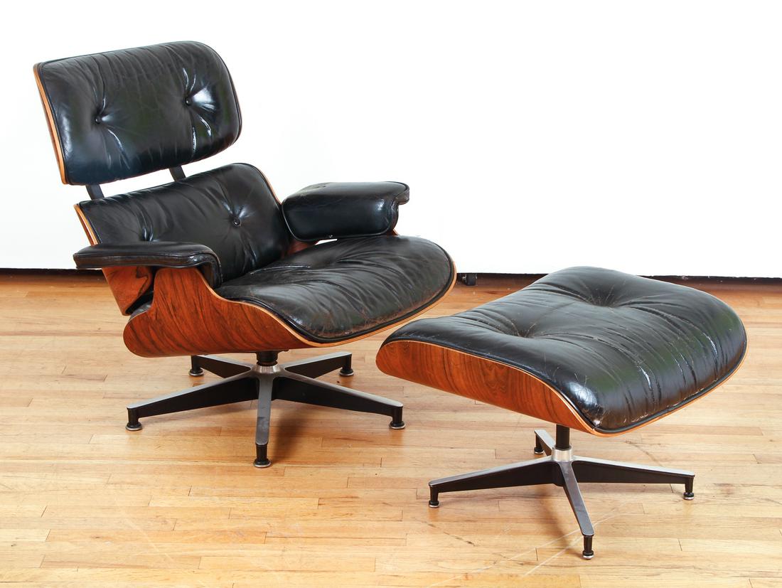 Herman Miller Lounge Chair and Ottoman: Herman Miller lounge chair and ottoman, models 670 and 671, with black leather covering, with original hang tag and receipt, Chair: 31" x 32" x 29" Ottoman: 16" x 26" x 21"