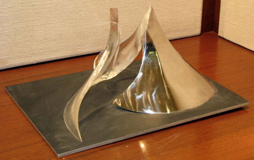 Marty Ingram Position #12 sculpture: Artist: Ingram, Marty (American, b. 1950) Title: Position #12 Date: 1981 Medium: stainless steel and lucite Dimensions: 7.5 x 16 x 7.5 inches Signature: signed M. Ingram 1981