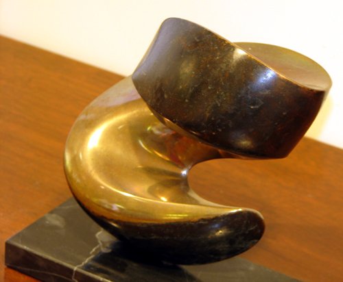 Marty Ingram Little Neutrino bronze: Artist: Ingram, Marty (American, b. 1950) Title: Little Neutrino Medium: bronze casting on wood base Dimensions: 6 x 2.5 x 5.5 inches Signature: apparently unsigned