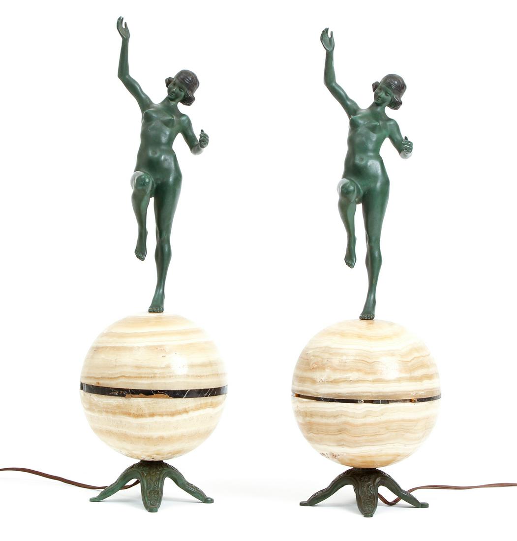 Pair Art Deco Figural Nude Lamps French: Pair of Art Deco lamps featuring a nude female figure, bronze with original deep green patina, standing atop an onyx globe, footed metal base, black marbled rim, one marked FRANCE on base, the other w