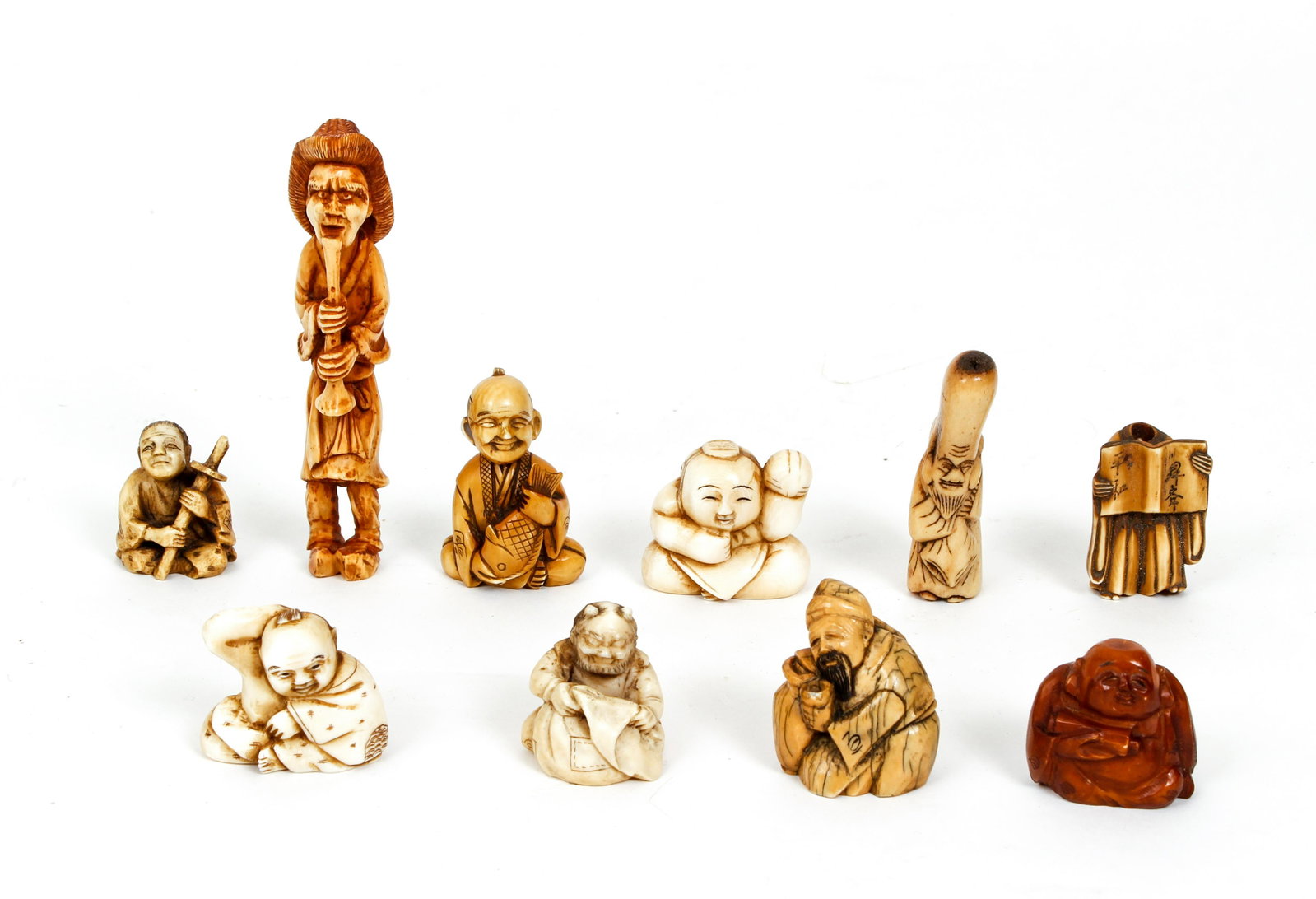 10 Figural Antler Netsuke: 10 Netsuke in various activities of antler bone, boxwood , tallest is 4.5 inches tall