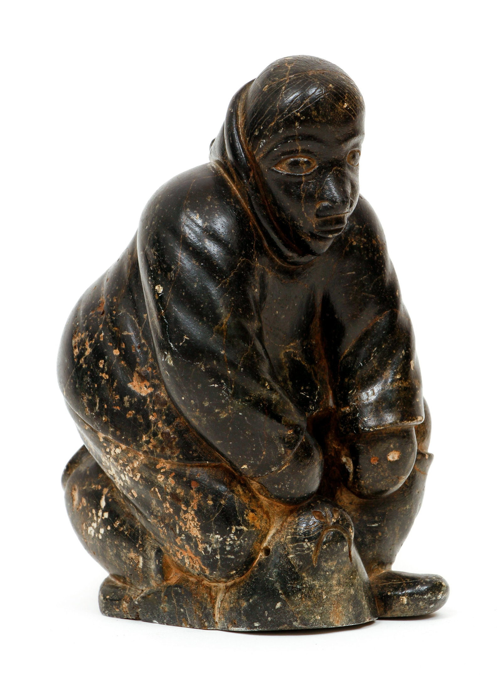 Timothy Qiatalla Eskimo/Inuit soapstone Hunter Seal: Timothy Qiatalla Assappa, Hunter with Seal, 1981, carved soapstone, 7.25 x 5 x 5 inches, inscribed and dated on underside, E Number E9-811 incised on the bottom, the artist was from Puvirnituq (former