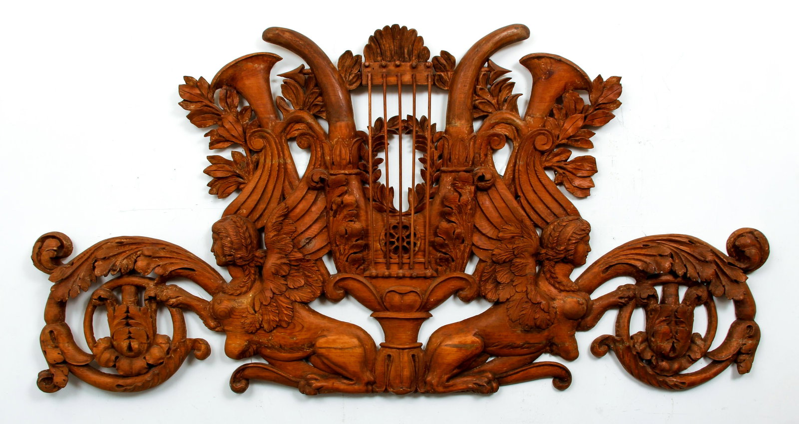 Carved wood Architectural Cartouche: Architectural relief with winged griffins, horn of plenty, vigorously carved, 34 x 70 x 3 inches