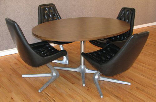 4 Chromcraft Star Trek Chairs with Round Table: Chromcraft, After Kagan, Vladimir 4 Star Trek Chairs with Round Table Black button vinyl with V shaped bases 36 x 22 x27 inches (chairs); 28.5 x 59.5 x 44.5 inches (table) Chromcraft, Senatobia, Miss.