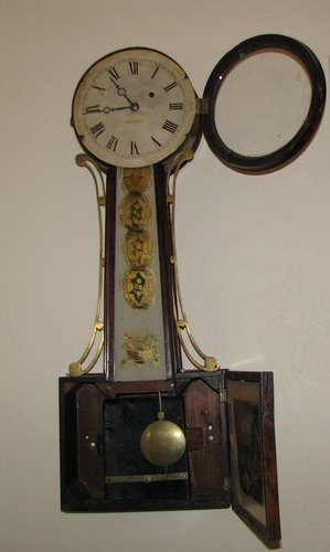 GD Hotsk Banjo Clock: Artist: Title: GD Hotsk Banjo Clock with Several areas of reverse glass painting Medium: glass and mahogany Dimensions: 29 x 10 x 4 inches Signatu