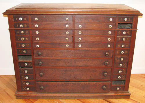 Ant. Moveable Type Printer Cabinet w Numbered Drs.: Title: Antique Printers Cabinet with Numbered Drawers for moveable type storage Medium: oak Dimensions: 36.5 x 47.5 x 21 inches