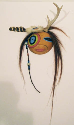 Contemp Native American Mask G. R. Tsonakwa: Artist: Tsonakwa, Gerard Rancourt (Contemporary Native American) Title: Pudjinskwes Date: 1991 Medium: carved and painted wood, feathers, leather, antle