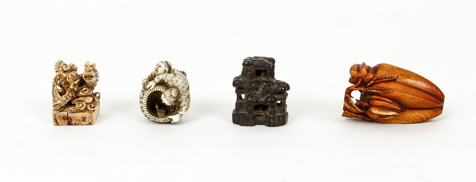 4 Netsuke including Flower Pod: 4 Netsukes of painted bone, antler, and boxwood