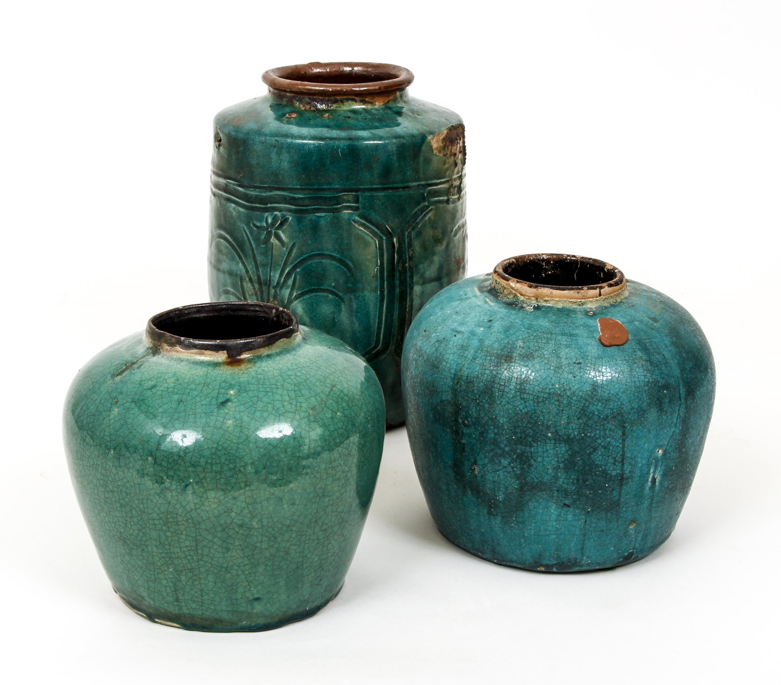 3 Chinese Stoneware Turquoise glazed pots: Chinese glazed stoneware pots with the largest with relief, Flower decorations in the reserves, 12.5 inches tall, 8 inches tall, 7.75 inches tall., likely from rural chine with wax seal residue on the