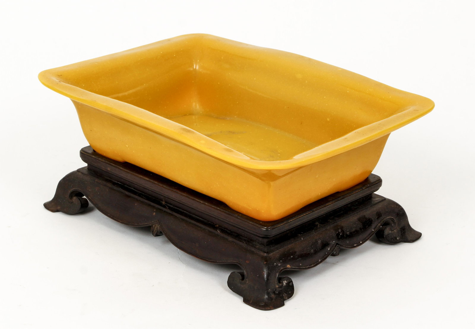 Chinese Yellow Bowl possibly Jadeite: Chinese decorative bowl, possibly yellow jadeite, with original fitted wood base, bowl alone 2.25 x 9.75 x 7.25 inches.