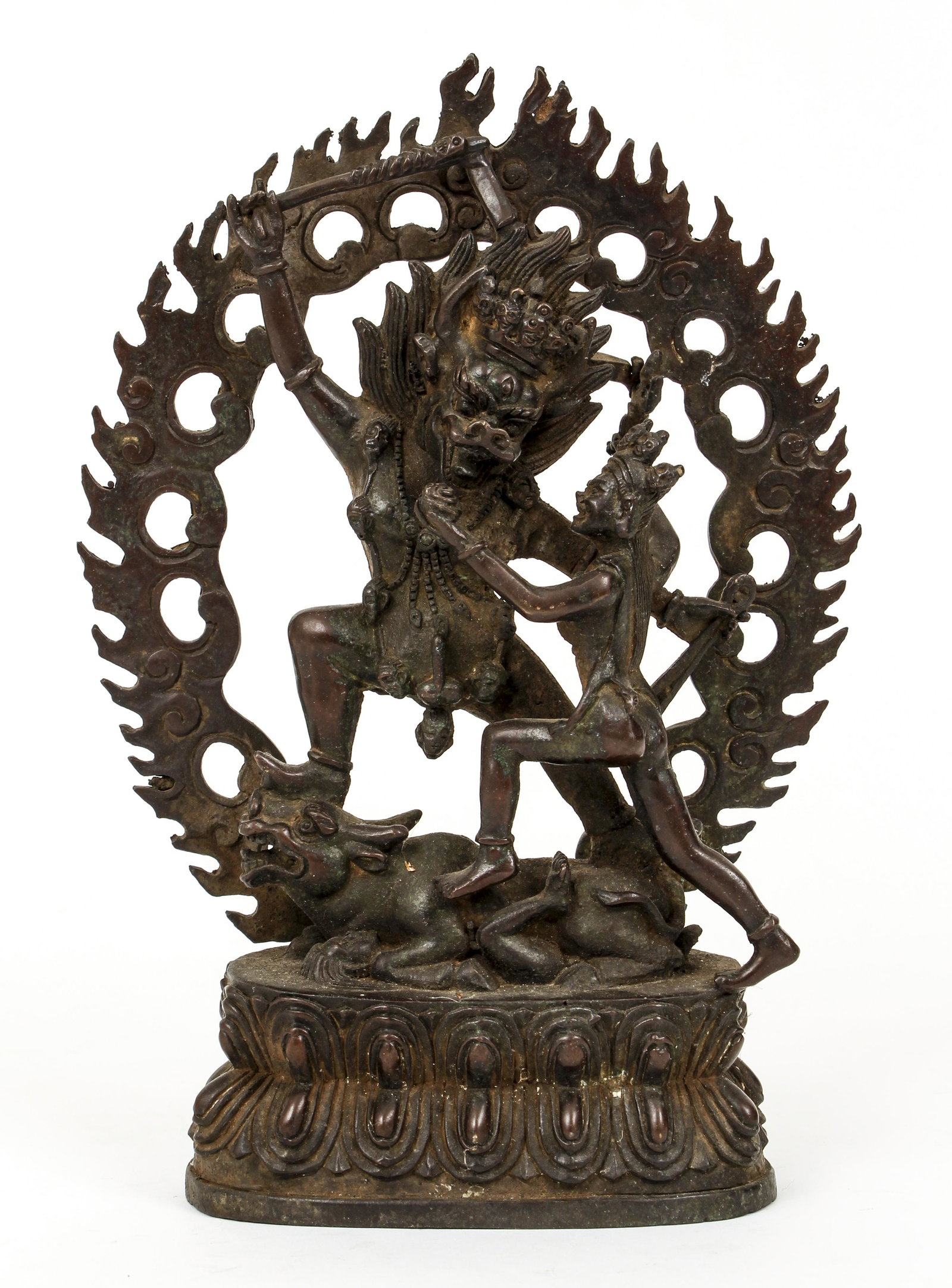 Tibetan Bronze Fierce Deity and Human: Tibetan Bronze showing a Fierce Deity Attacking a Human, c.20th century, 8.75 x 6.5 inches, central figure with horns, raised club, about to strike an approaching human, standing atop a cow life figur