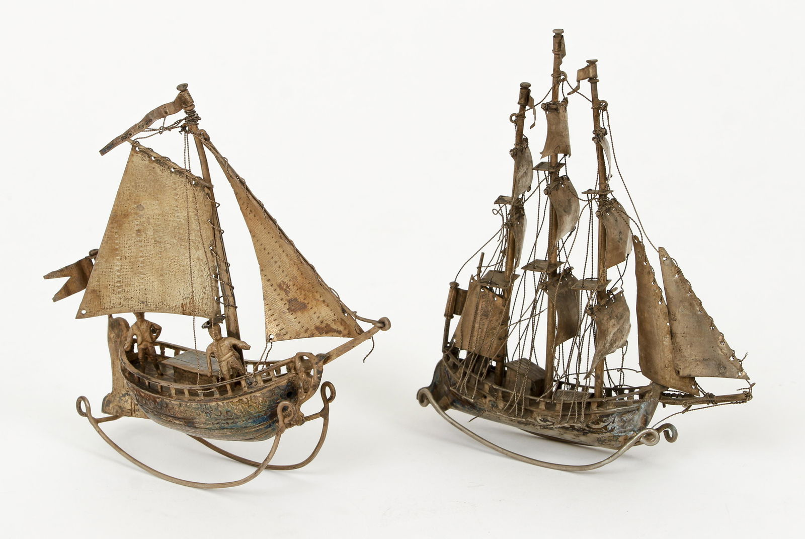 2 Dutch 833 silver miniature sailing ships: 2 sailing ships on sled bases made in Holland, 833 silver, tallest ship 4.5 inches, total weight 3.01 ozt.