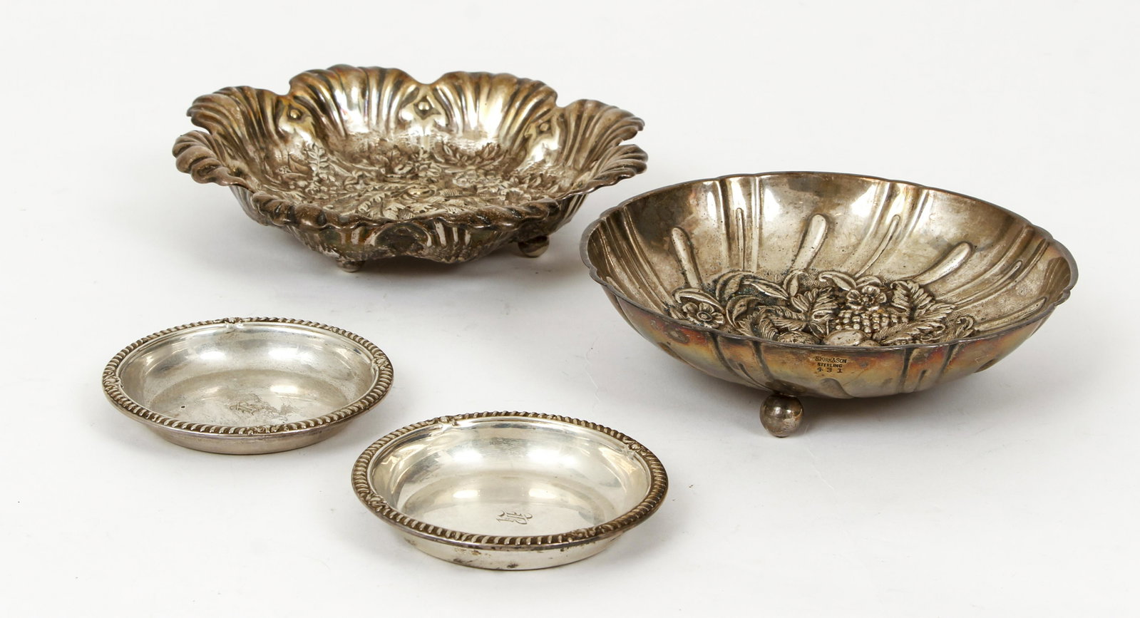 4pcs Assorted Sterling Silver Trays 11.3ozt: 4 pieces of assorted sterling silver: S Kirk and Son footed tray with floral and fruit design, B. H. and Co. footed tray with floral design, and a pair of Birks finger bowls. Total combined weigh 11.3