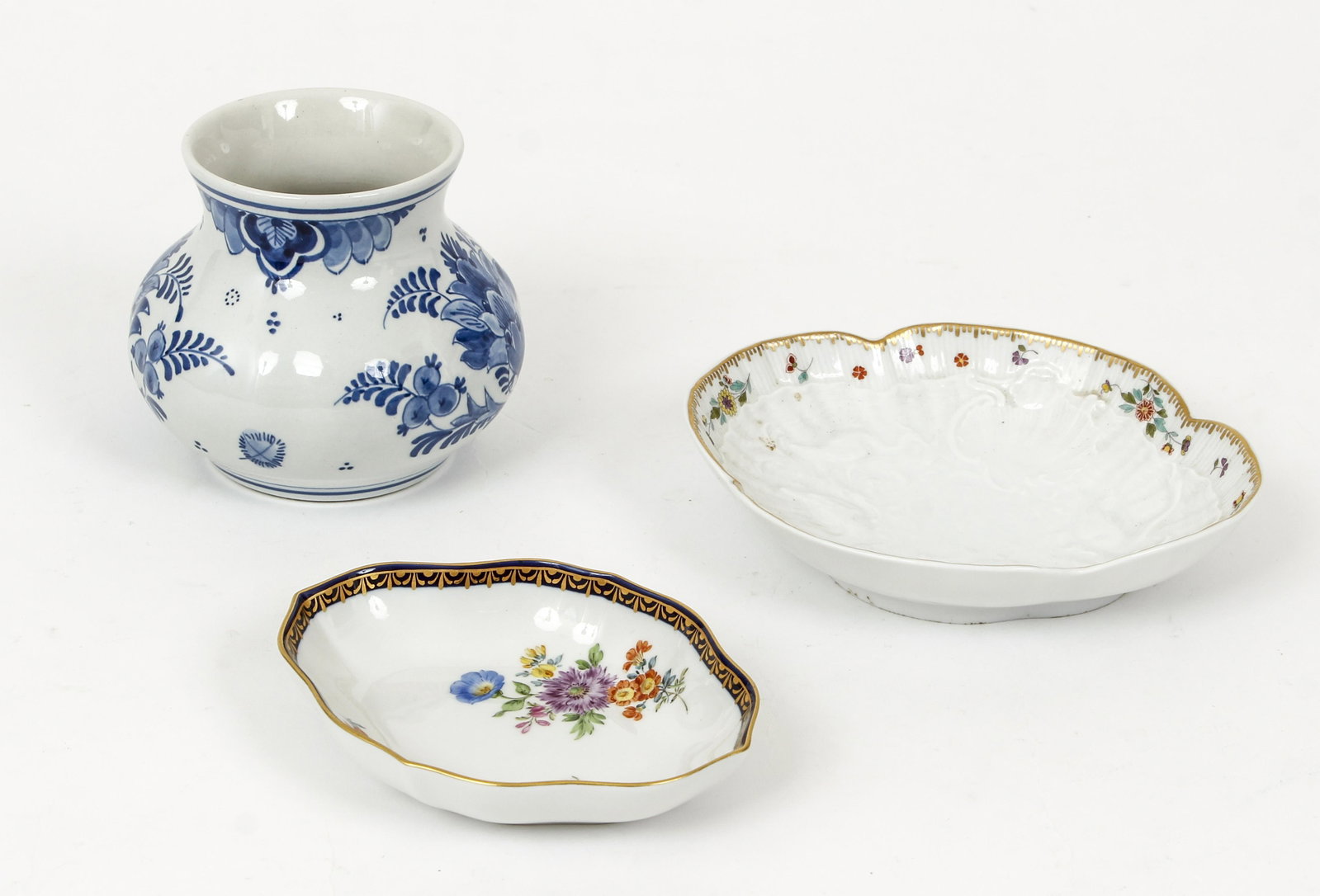 2 Meissen sweet meat dishes and small Delft pot: wildflower decorated Meissen sweet meat the largest being 6 inches long and Delft blue decorated small pot 3.5 inches tall.