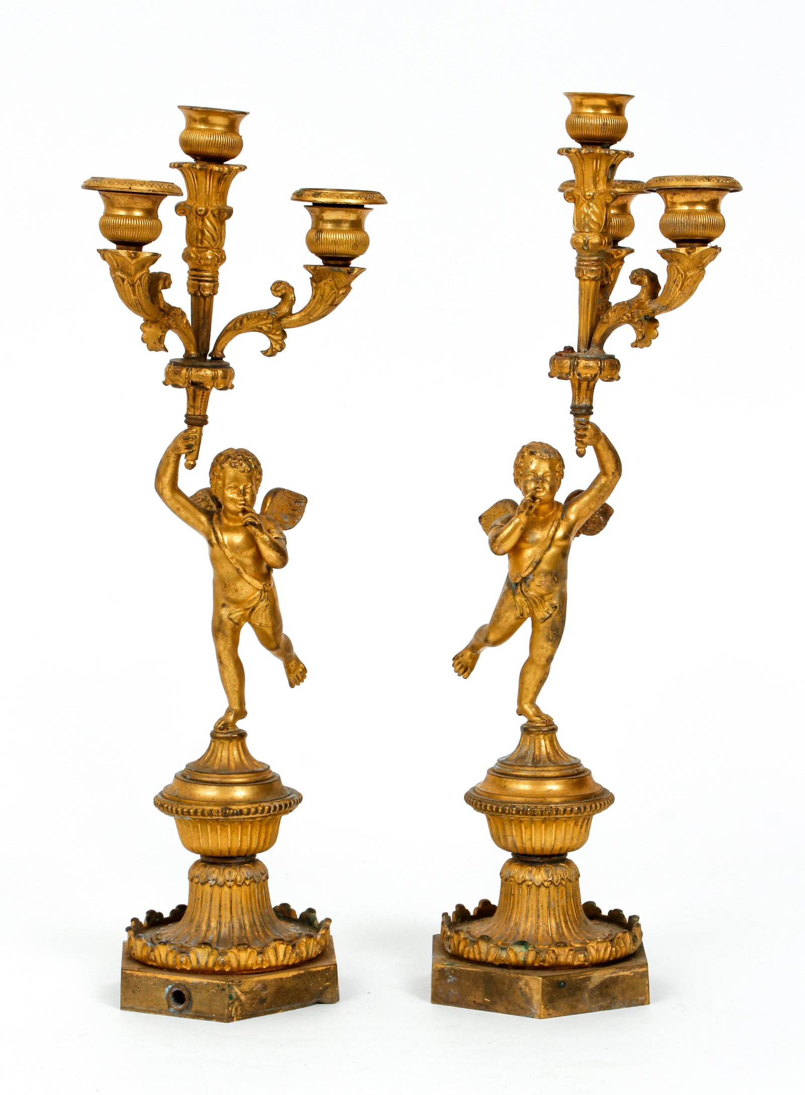 Pair of French 3-light gilded Putti Candelabra: 3 Light Candelabra gilded brass or bronze on classical bases with Putti holding the torchiere, 17 inches tall, well cast figures