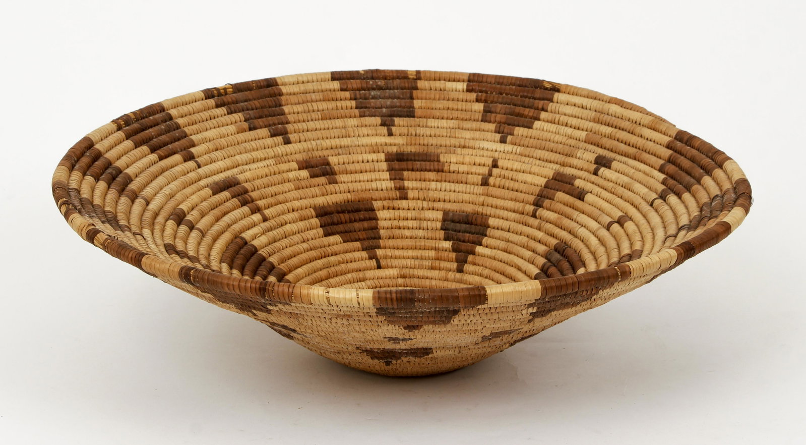 Large Native American or African Woven Basket: Native American (possibly Pacific Northwest) or African (Botswana) Woven Basket, height 5 inches, diameter 18 inches.