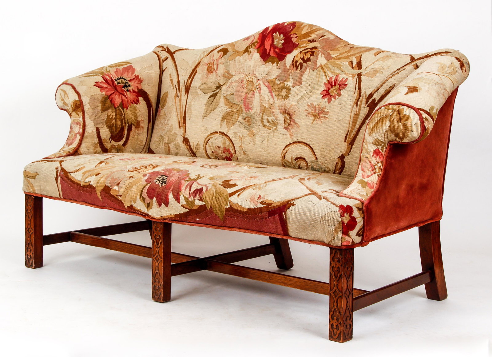 Childs Upholstered Sofa: Childs Upholstered Sofa with Floral and vine upholstery and carved wooden front legs, 28 x 44 x 20 inches.