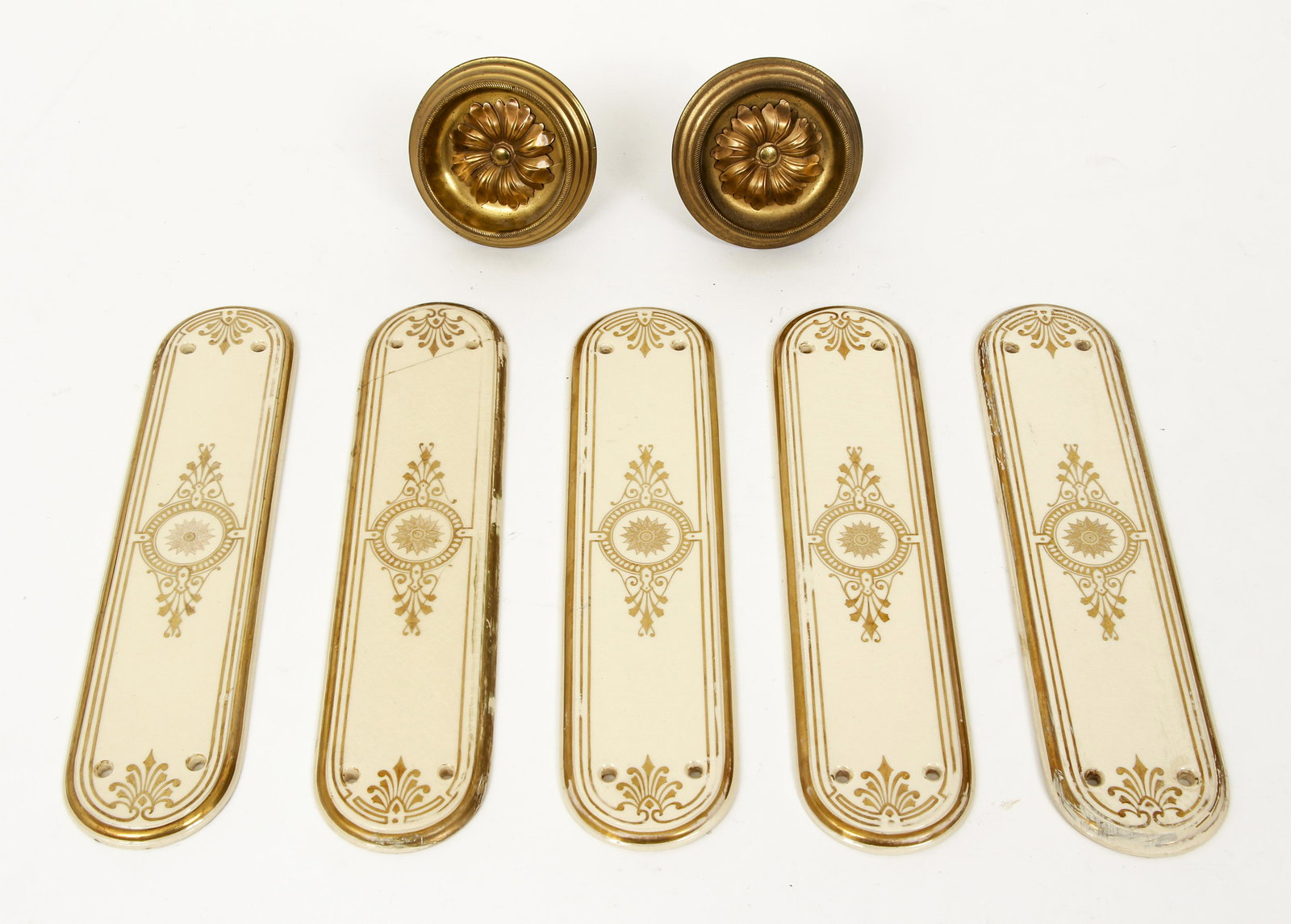 5 porcelain push plates and 2 brass curtain tie backs: 5 porcelain door push back plates with gilded decoration 11.5 inches tall and 4 screw holes, two brass curtain tie backs 4 inches in diameter