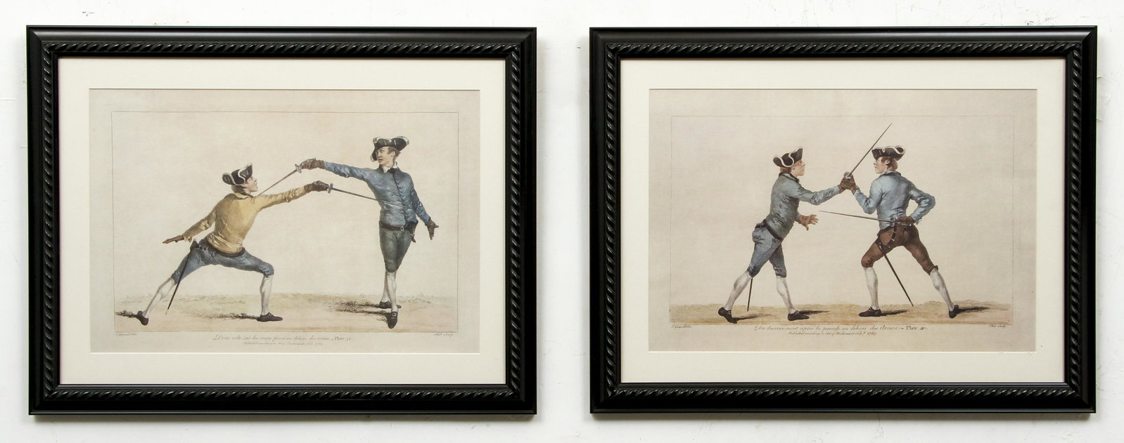 Pair Decorative Fencing Prints: Pair of decorative fencing prints, 20th century reprints, framed 16 x 21.5 inches.