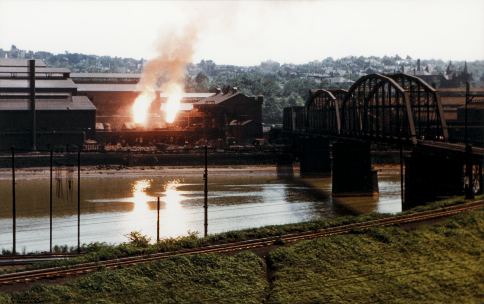 3 framed Prints, McKeesport, Slag Heap, Fiery Mill: 2 Jeff Madden prints McKeesport and Slag Dump, with Steel Mill near Hot Metal Bridge by Harry Knott, all framed measuring approximately 20 x 27 inches framed