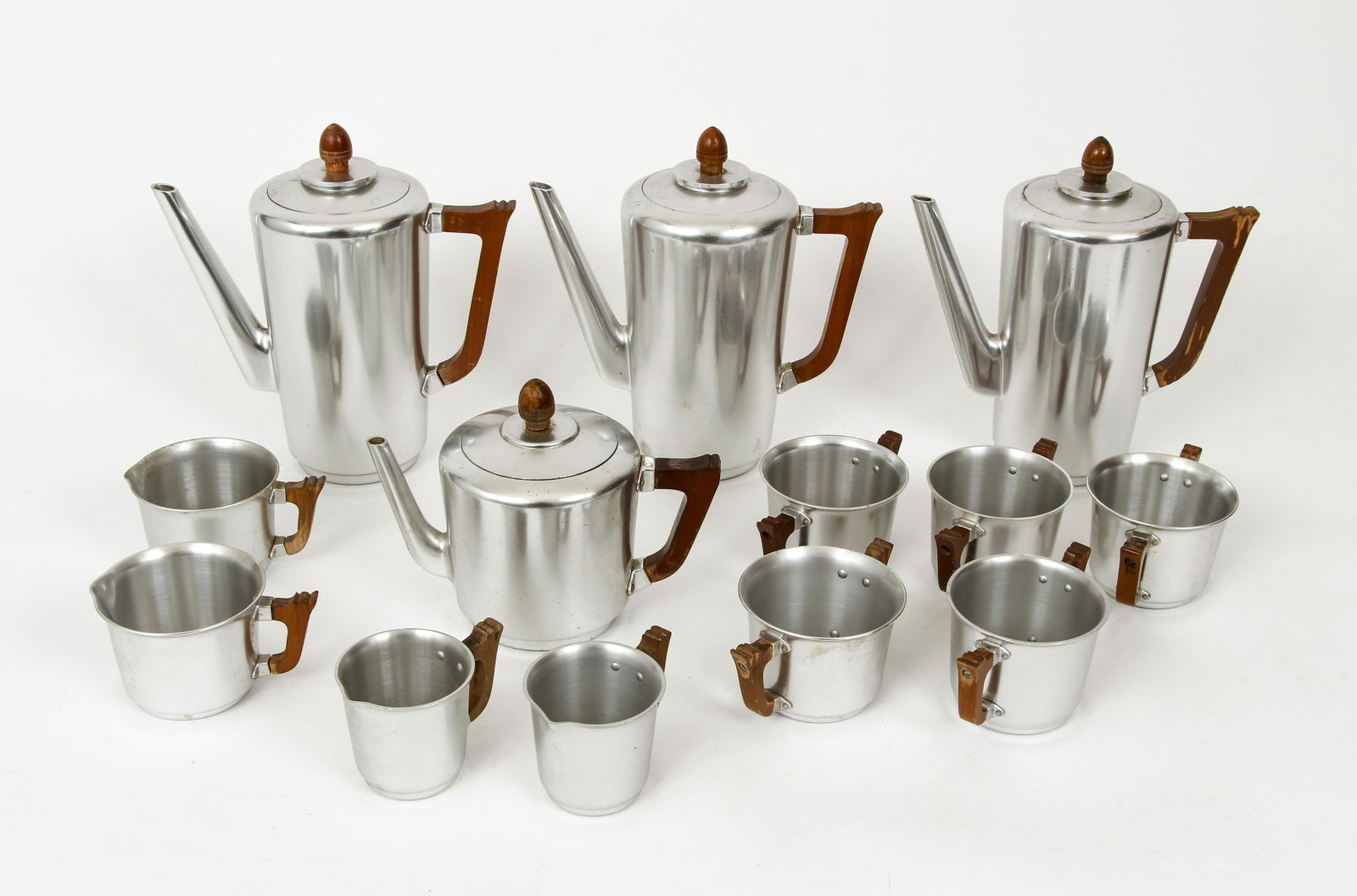 13pc Kensington Ware Mayfair Coffee Service: 13 piece lot of Kensington Ware, coffee and tea service in the Mayfair pattern, aluminum, includes 3 coffee pots, 1 tea pot, 5 sugar bowls, 2 creamers and 2 coffee cups, each one etched on base, coffe
