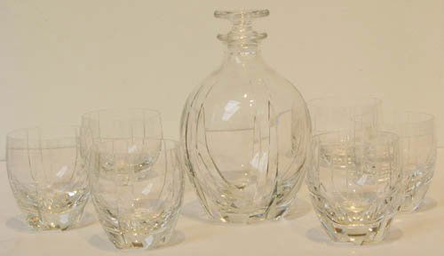 Baccarat Decanter and 6 Tumblers: Artist: Baccarat Title: Baccarat Decanter and 6 Tumblers Medium: crystal Dimensions: 8 x 4 1/2 x 4 1/2, tumblers 4 x 3 1/8 x 3 1/8 inches